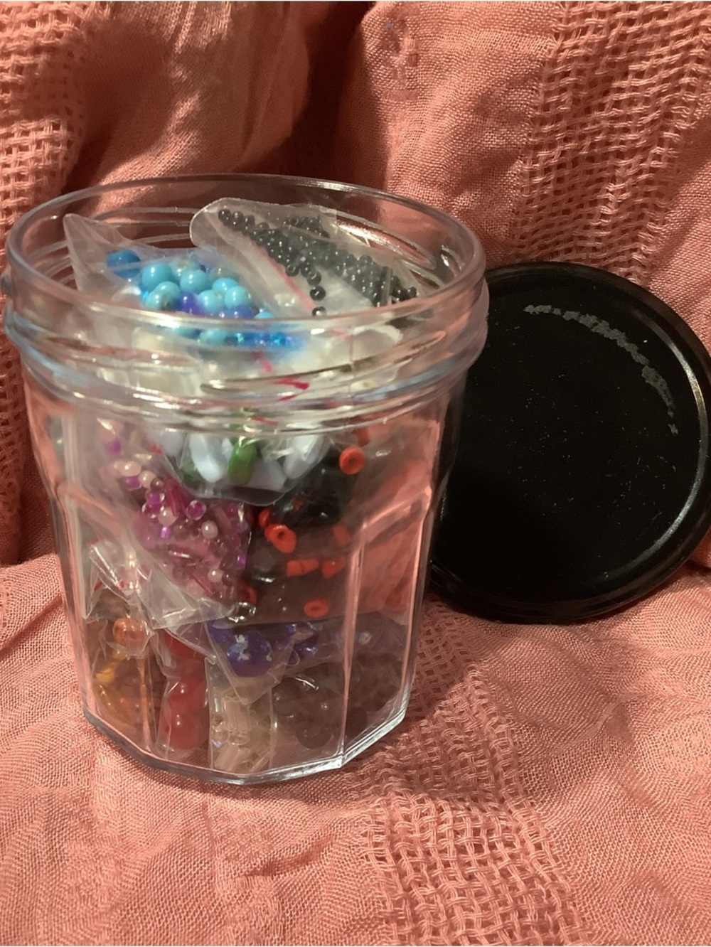 Clear Glass Jar Filled with Multicolor Beads